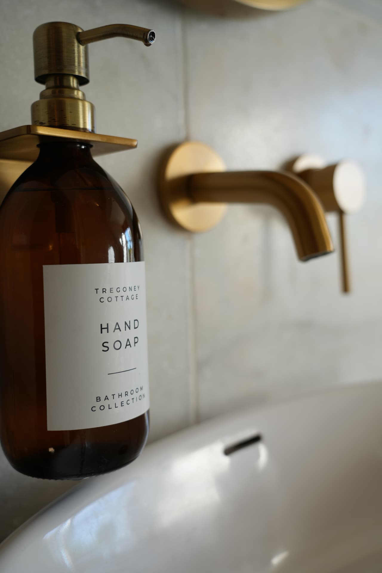 Tregoney amber soap bottle on a brass bracket