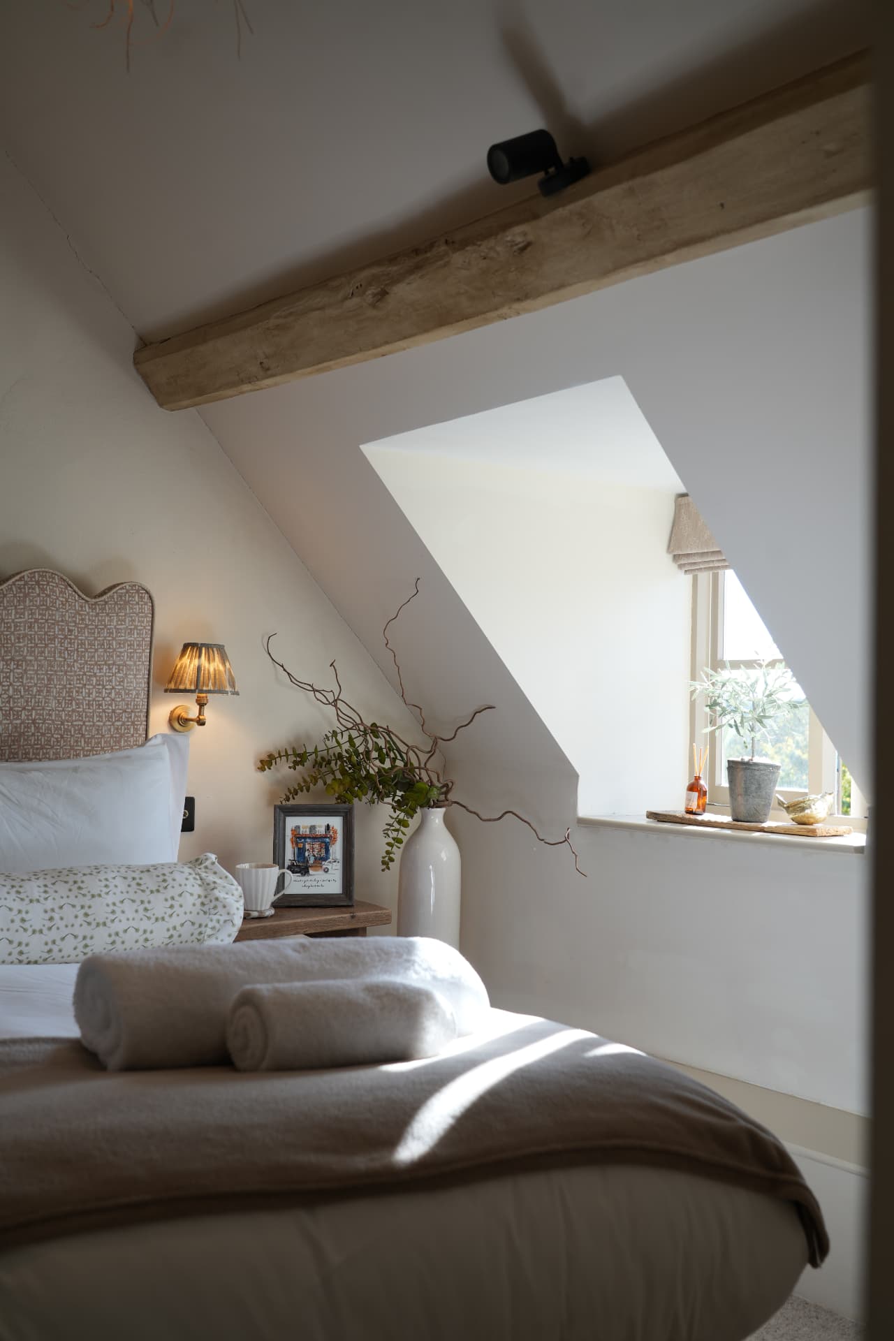 Attic bedroom beneath a dormer window