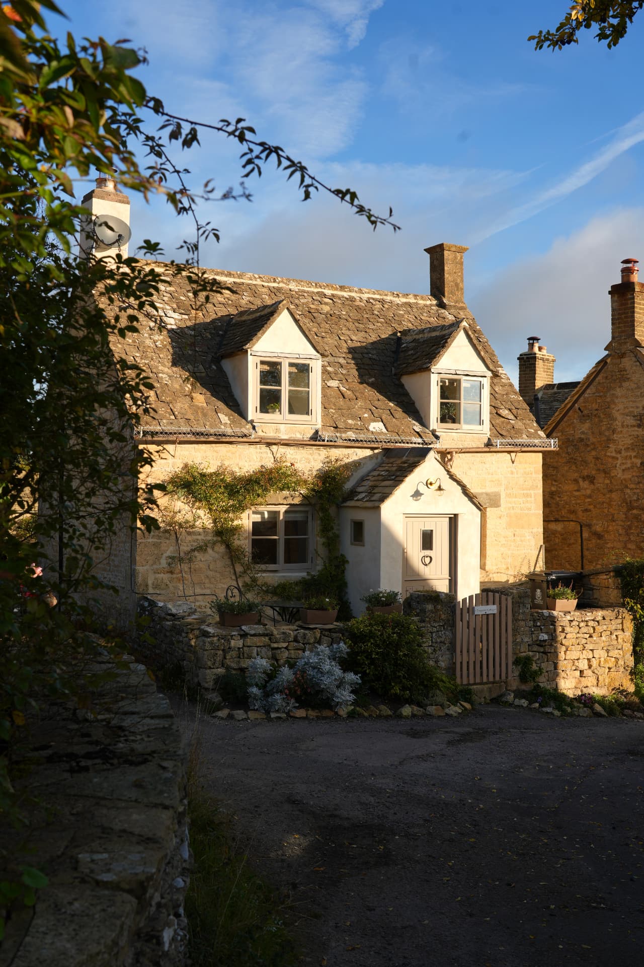 Tregoney Cottage, a stone cottage in soft daylight